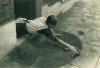 A Lady Cleans Her Doorstep